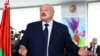 Belarusian President Alexander Lukashenko votes during the presidential election in Minsk