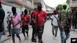 Manm Gang "G9 ak Fanmi" pran lari pou manifeste kont Premye Minis Ariel Henry nan Potoprens, Ayiti, 19 Sept. 2023. 