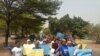 Protesters in Abuja, Nigeria, hold up placards as they chant for peace and call for evacuation of Nigerian students and nationals stranded in Ukraine, Feb. 28, 2022. (Timothy Obiezu/VOA)