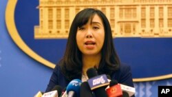 FILE - Vietnamese Foreign Ministry spokeswoman Le Thi Thu Hang speaks to reporters during a regular press briefing in Hanoi, Vietnam, Aug. 3, 2017. 