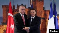 Turkish President Erdogan meets with French President Macron in Madrid