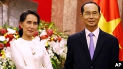 Ông Trần Đại Quang tiếp đón lãnh đạo Miến Điện, bà Aung San Suu Kyi, ở Hà Nội hôm 13/9.