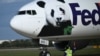 A FedEx cargo jet transporting two giant pandas from China lands at Dulles airport in Virginia, Oct. 15, 2024.