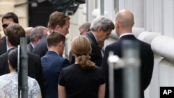 Ngoại trưởng Mỹ John Kerry đến Palais Coburg ở Vienna, nơi diễn ra cuộc đàm phán hạt nhân Iran, ngày 8/7/2015.