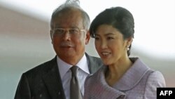 Thủ tướng Thái Lan Yingluck Shinawatra (phải) và Thủ tướng Malaysia Najib Razak