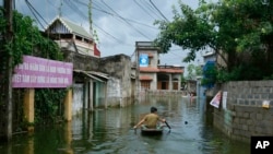 Ảnh minh họa: Cảnh lụt ở huyện Chương Mỹ, Hà Nội, ngày 31/7/2018. (AP Photo/Manh Thang)