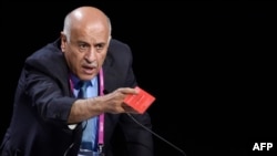 Palestinian football chief Jibril Rajoub shows a red card as he speaks during a FIFA Congress in Zurich, Switzerland, May 29, 2015.