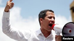 Lãnh đạo phe đối lập Venezuela Juan Guaido phát biểu trong một cuộc tập hợp biểu tình phản đối Tổng thống Venezuela Nicolas Maduro ở Caracas, ngày 9 tháng 3, 2019.