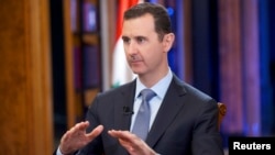 Syria's President Bashar al-Assad speaks during an interview with Fox News channel in Damascus, Sept. 19, 2013. ( SANA Handout photo)