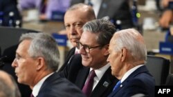 US President Joe Biden (R) speaks with UK Prime Minister Keir Starmer as Turkish President Recep Tayyip Erdogan looks on during a Working Session of the NATO Summit at the Walter E. Washington Convention Center in Washington, DC, July 11, 2024. (Photo by 