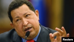 Tổng thống Venezuela Hugo Chavez nói chuyện tại một cuộc họp báo trong thủ đô Caracas của Venezuela sau khi tái đắc cử, 9/10/12