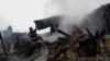 Firefighters work at the site of residential buildings hit by a Russian drone strike in Kharkiv, Ukraine, Dec. 25, 2024.