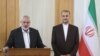 Palestinian group Hamas' top leader, Ismail Haniyeh and Iran's Foreign Minister Hossein Amir Abdollahian attend a press conference in Tehran