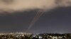 FILE PHOTO: An anti-missile system operates after Iran launched drones and missiles towards Israel, as seen from Ashkelon