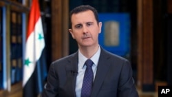 Tổng thống Syria Bashar al-Assad phát biểu trong một cuộc phỏng vấn tại Damascus.