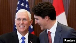 Thủ tướng Canada, Justin Trudeau (phải) và Phó Tổng thống Mỹ Mike Pence gặp nhau tại Canada, ngày 30/5/2019.