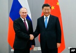 Rusya lideri Vladimir Putin ve Çin Lideri Xi Jinping