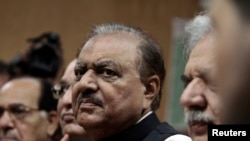 Mamnoon Hussain, presidential candidate of the Pakistan Muslim League-Nawaz (PML-N) party, stands as he submits his nomination papers for the upcoming presidential election at the High Court in Islamabad July 24, 2013. Pakistan’s ruling party has chosen a