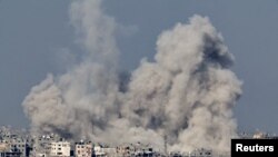 Smoke rises over Gaza, amid the ongoing conflict between Israel and the Palestinian Islamist group Hamas, as seen from southern Israel