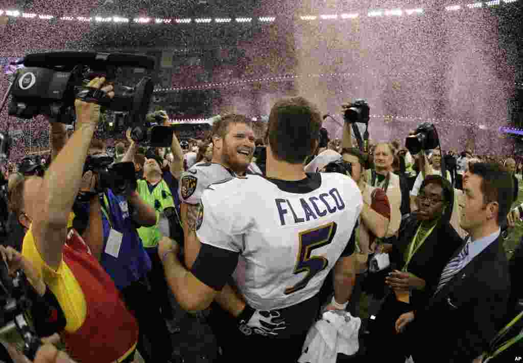 Baltimore Ravens quarterback Joe Flacco (5) and offensive lineman Marshal Yanda (73) celebrate their team's 34-31 win against the San Francisco 49ers in the NFL Super Bowl XLVII football game, Sunday, Feb. 3, 2013, in New Orleans.