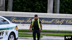 A Sherrif block the street outside the Trump International Golf Club in West Palm Beach, Florida, on September 15, 2024 following a shooting incident at former US president Donald Trump's golf course.