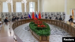 Russian President Vladimir Putin meets with Chinese President Xi Jinping in Samarkand