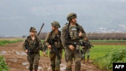 Israeli soldiers patrol an area near the northern kibbutz of Kfar Blum close to the border with Lebanon after Hezbollah said its fighters carried out an aerial attack with two drones against an Israeli air defense system site in the border region on Janua