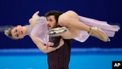 Madison Hubbell and Zachary Donohue of the United States perform their routine in the ice dance competition during the figure skating at the 2022 Winter Olympics, Feb. 14, 2022, in Beijing.