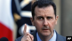 Tổng thống Syria Bashar al-Assad nói chuyện tại một cuộc họp báo