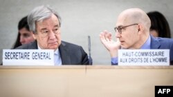 UN Secretary-General Antonio Guterres (L) and UN High Commissioner for Human Rights Volker Turk talk as they arrive for the opening of 55th session of the Human Rights Council in Geneva on February 26, 2024. (Photo by GABRIEL MONNET / AFP)