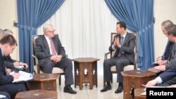 Tổng thống Syria Bashar al-Assad gặp Thứ trưởng Ngoại giao Nga Sergei Ryabkov tại Damascus, ngày 18/9/2013.