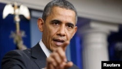 U.S. President Barack Obama addresses his year-end news conference in the White House briefing room in Washington, December 20, 2013. REUTERS/Jonathan Ernst (UNITED STATES - Tags: POLITICS) - RTX16PYE